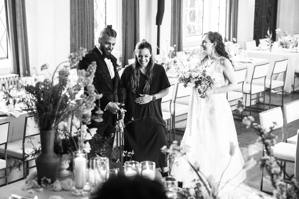 wedding reception first look luxe sweetheart table bay area wedding planner black and white portrait bride and groom laughing portrait with wedding planner wedding reception decor