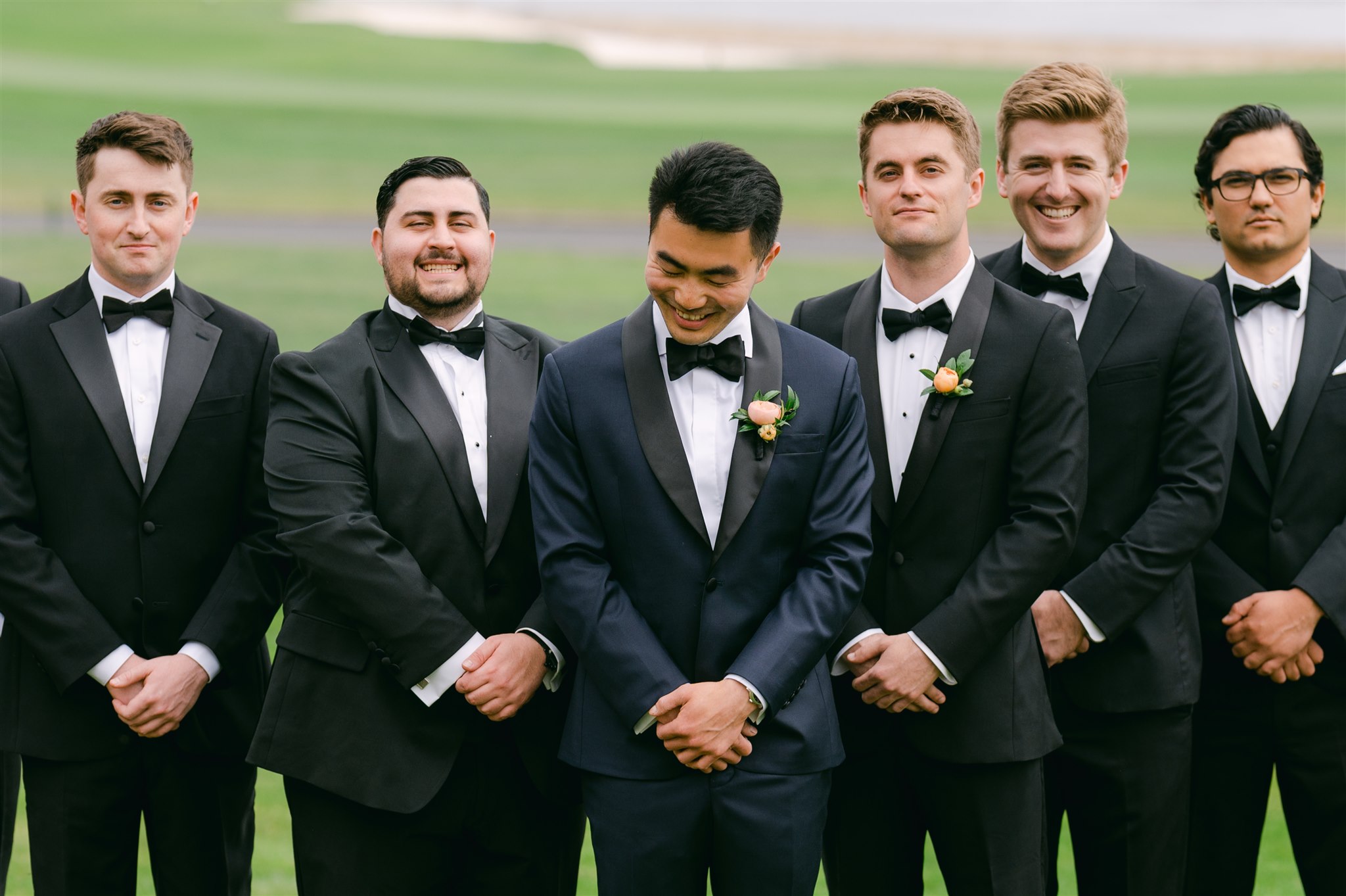 groomsmen smiling groom navy suit with black details