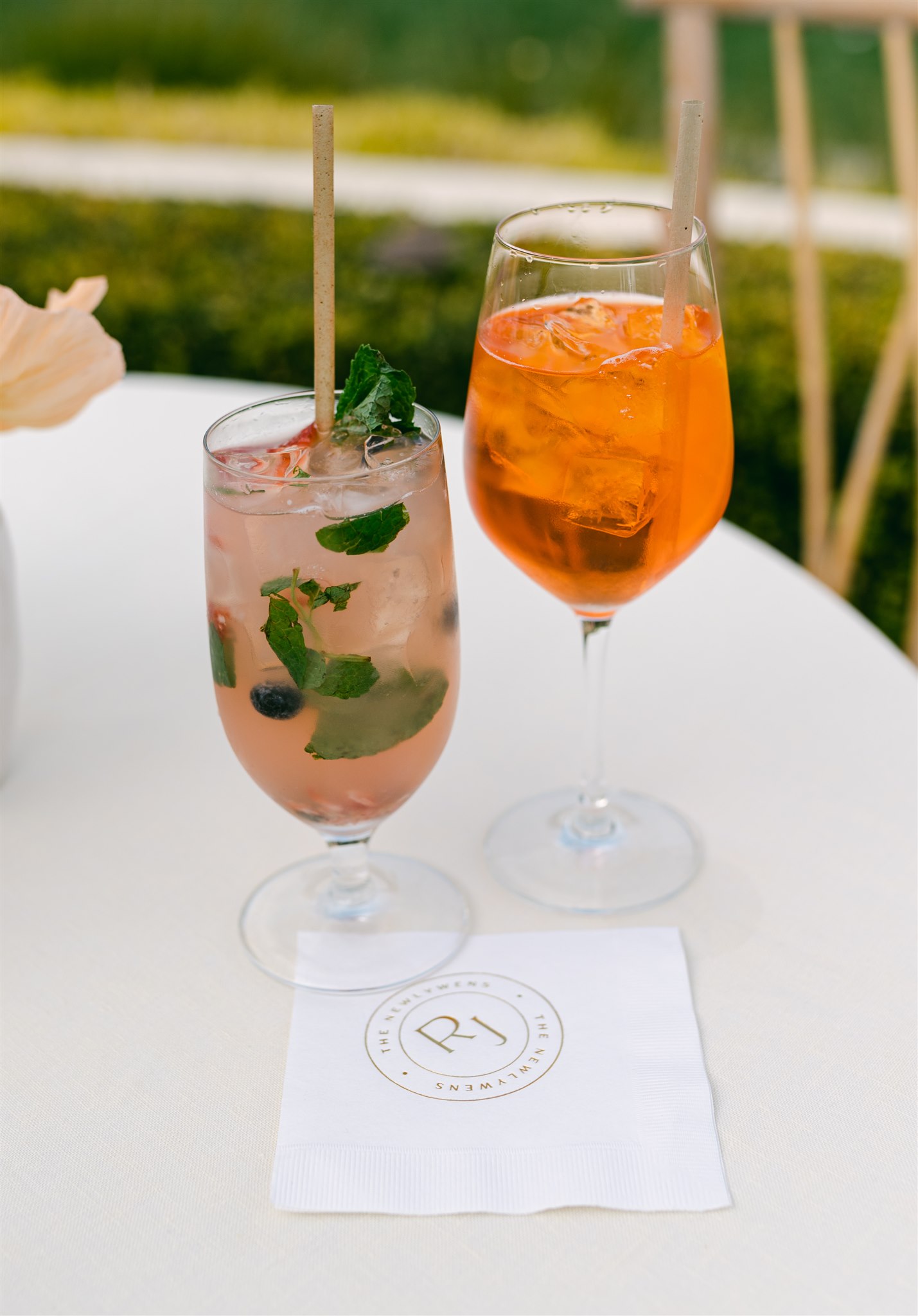 aperol spritz mint mojito mocktail summer wedding signature cocktail inspiration blush pink drink with sprigs of mint custom embossed wedding napkin 