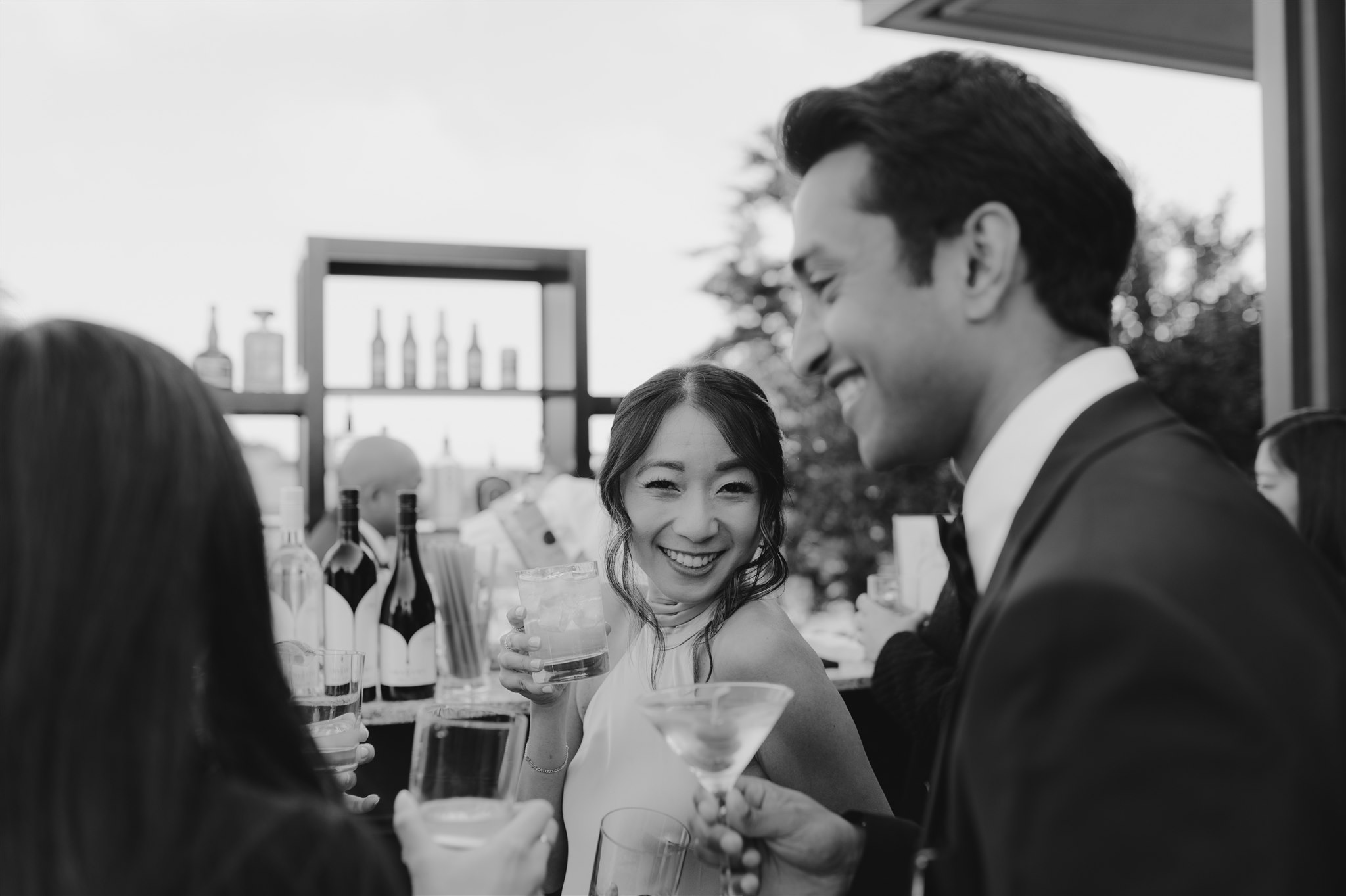 black and white wedding portrait wedding guest cocktail hour candid smiling open bar outdoor garden summer wedding