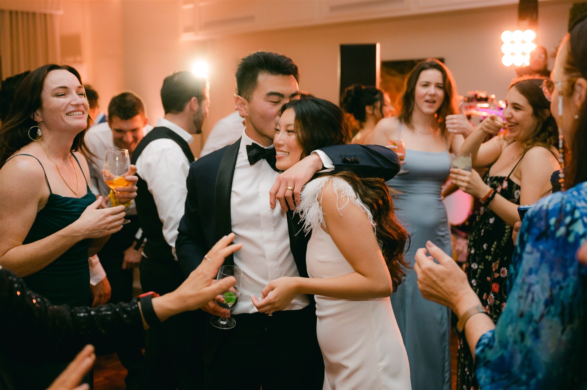 wedding dance party bride and groom kiss middle of dancefloor after party bridal wedding dress inspiration