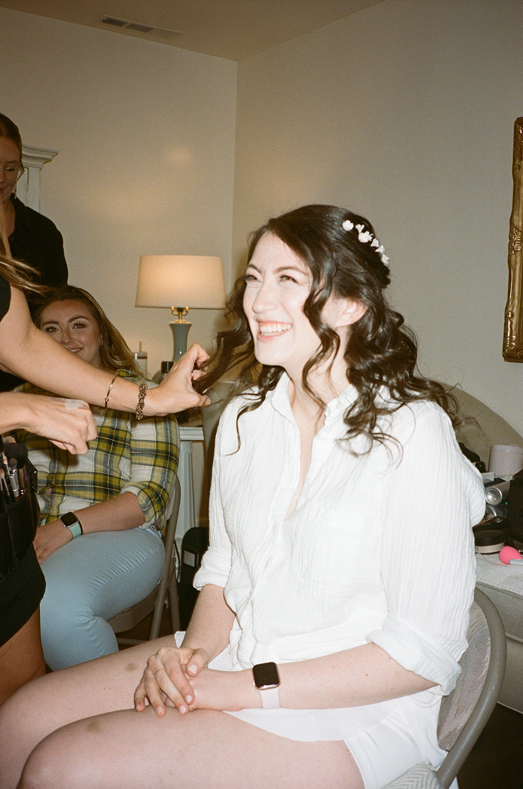 bride getting ready smiling flowers in hair beauty on set santa rosa wine country wedding 