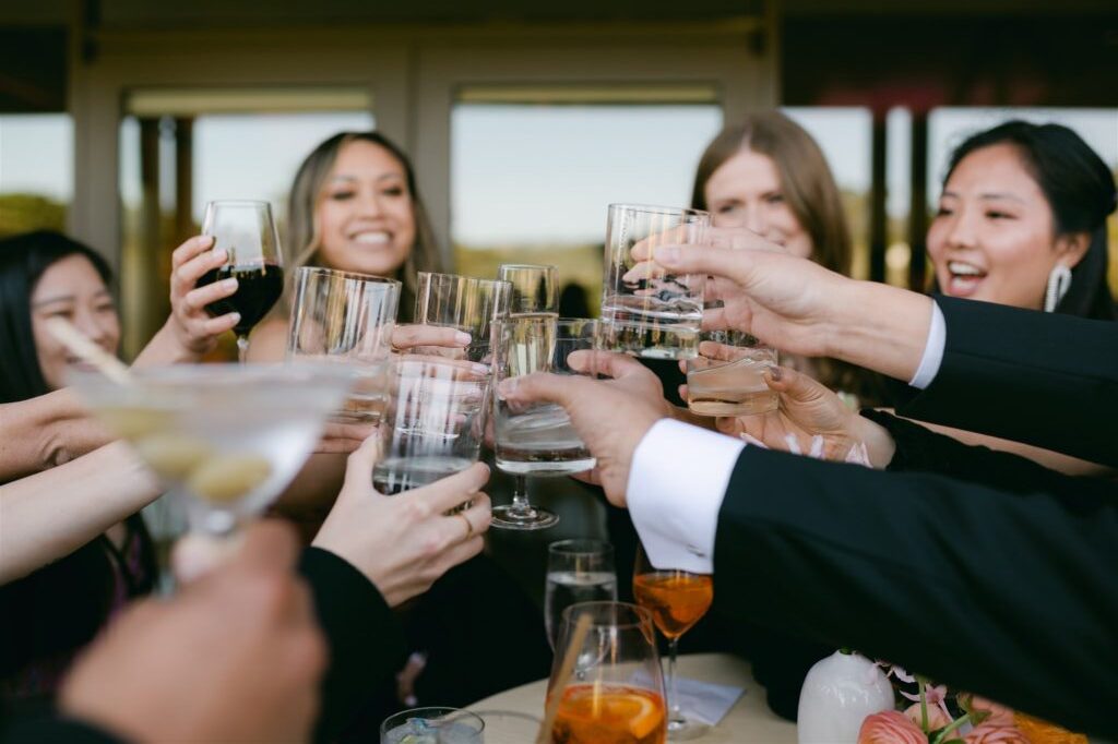 wedding guests cheers toasts open bar happy smiling joy